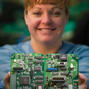 A lady showing open circuit board