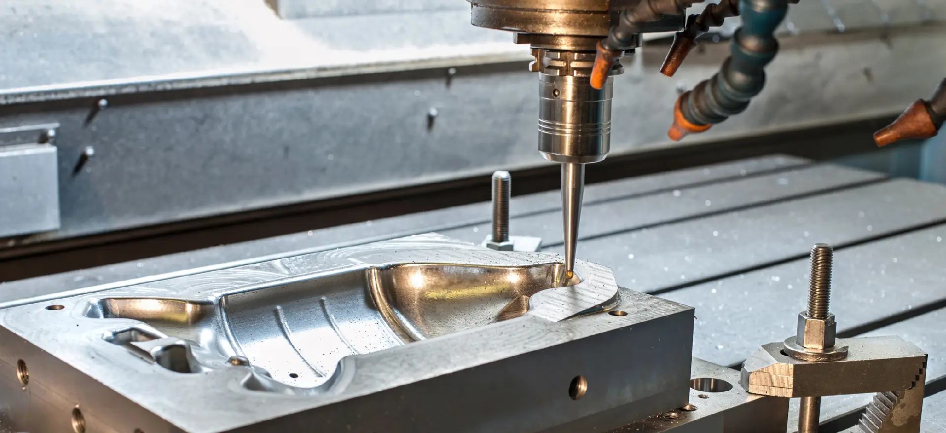 her0new (1) A machine is drilling into the metal part.